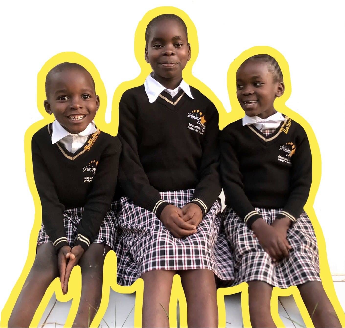 3 smiling students of the shining stars center of orphans