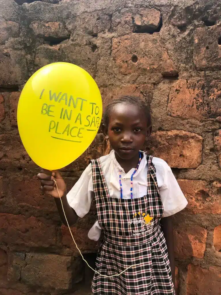 Gift Angel student in shining star center of orphans