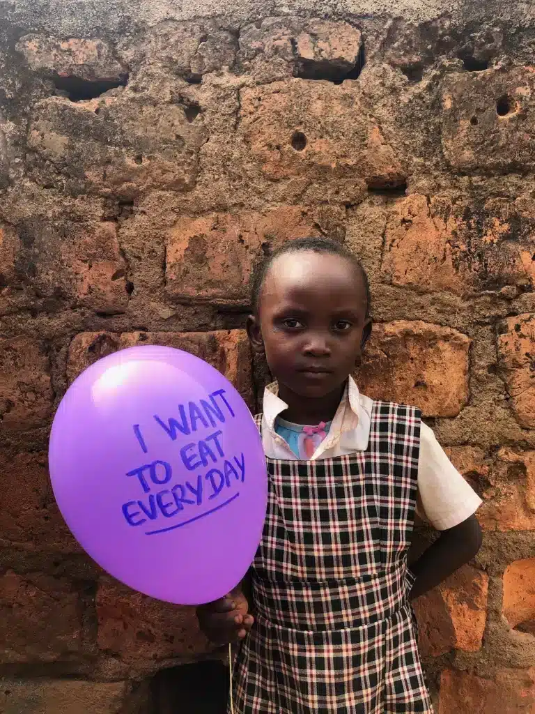 Joan Hazell student in shining star center of orphans