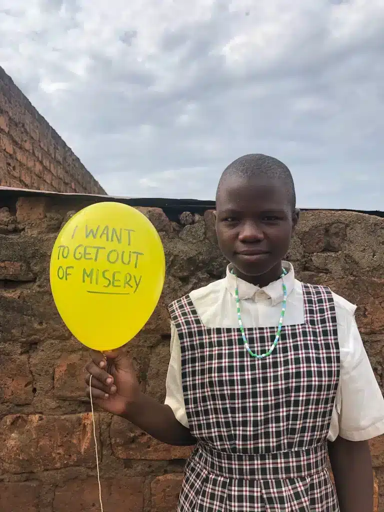 Magrate Aumo student in shining star center of orphans