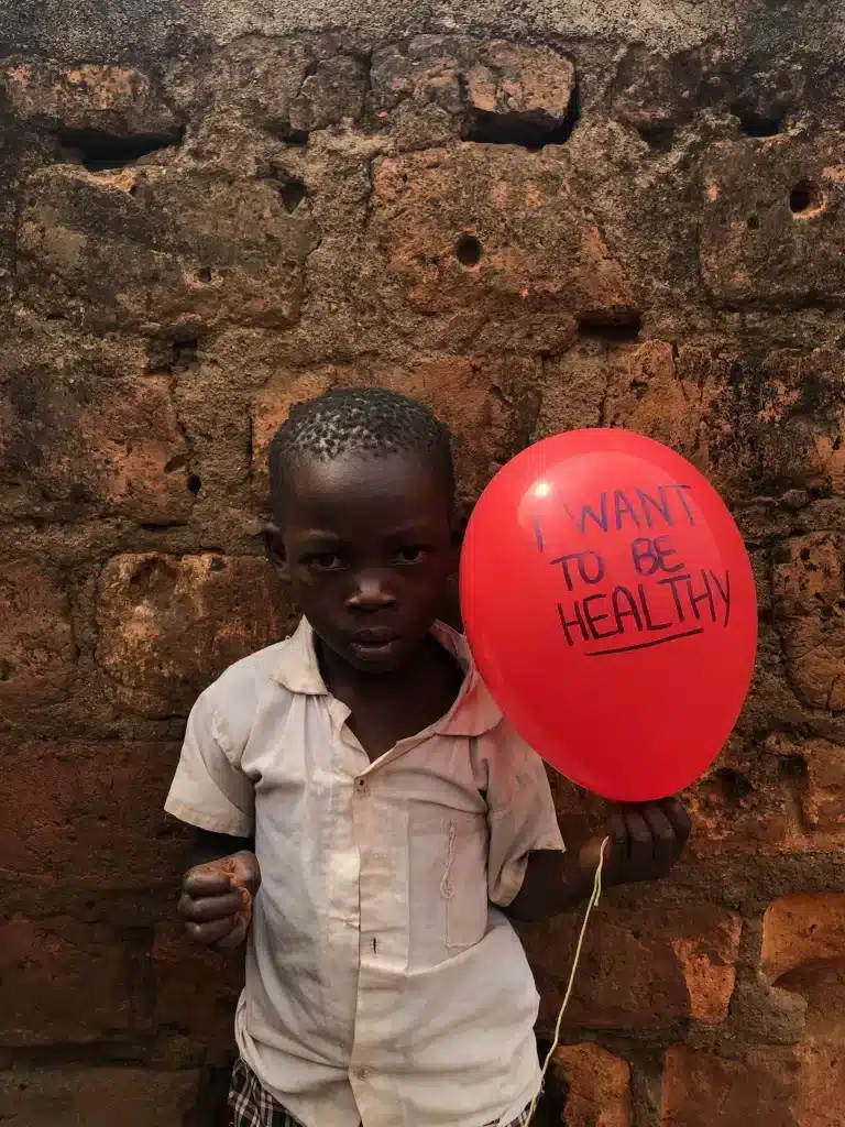 Mark Ronald student in shining star center of orphans