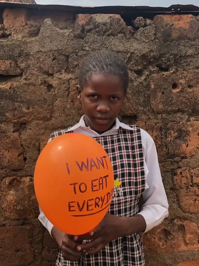 Ashley Marion student in shining star center of orphans