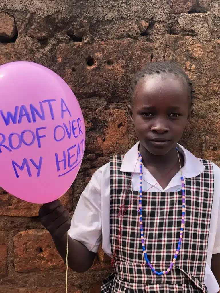 Cathy Night student in shining star center of orphans